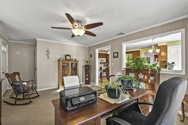 carpeted office space featuring ceiling fan, ornamental molding, a chandelier, and baseboards