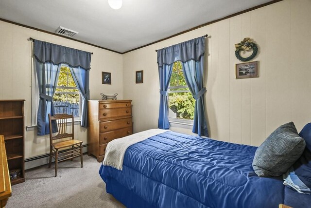 bedroom featuring carpet flooring, a baseboard heating unit, and ornamental molding