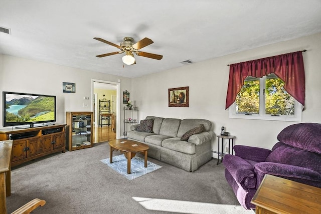 living room featuring a ceiling fan and carpet floors