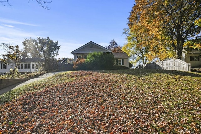 view of front of property featuring fence