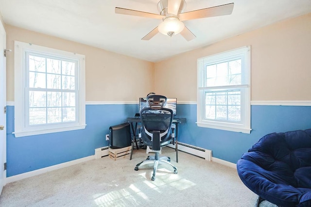 carpeted office featuring a baseboard heating unit, a baseboard radiator, a ceiling fan, and baseboards