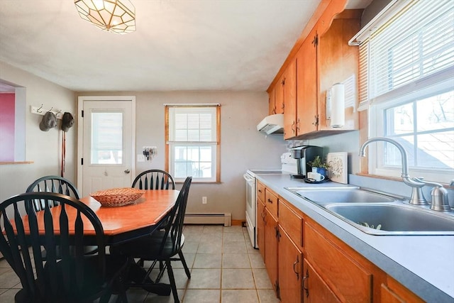 kitchen featuring a baseboard radiator, white electric range, brown cabinetry, a sink, and ventilation hood