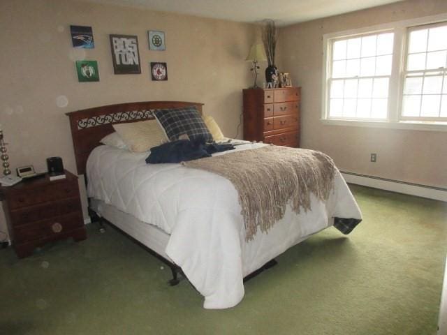 carpeted bedroom featuring a baseboard radiator