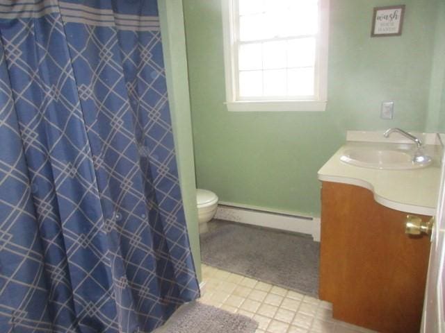 bathroom featuring toilet, a baseboard heating unit, curtained shower, and vanity