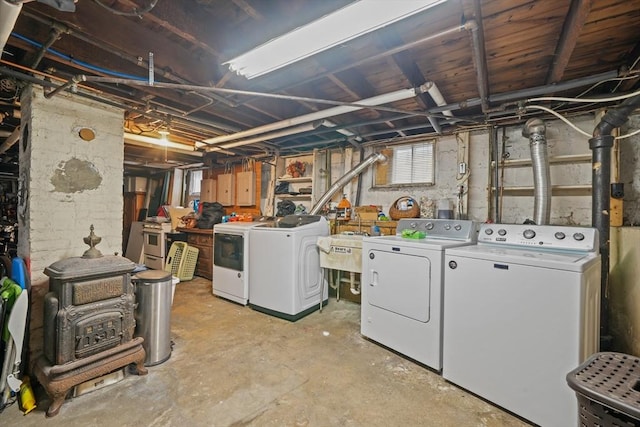 below grade area with a sink and washing machine and dryer