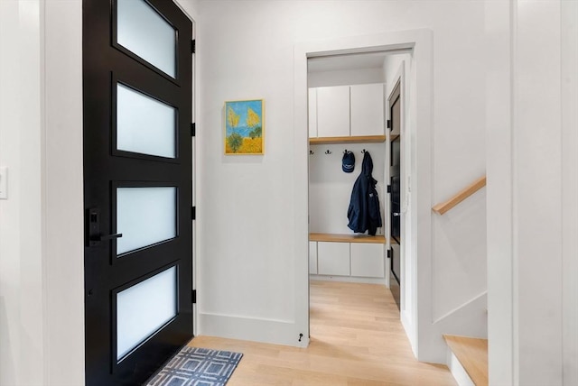 1242 Beacon St, Newton, MA 02468 - entrance foyer with light wood-style flooring and baseboards
