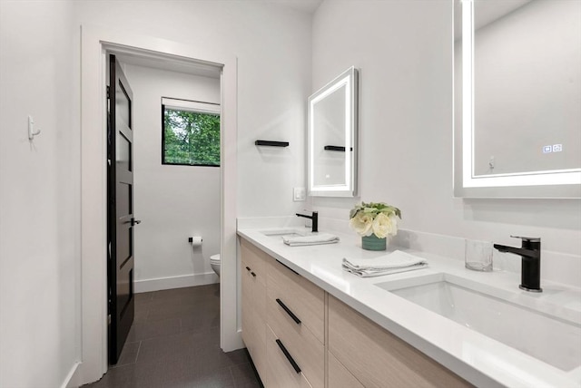 1242 Beacon St, Newton, MA 02468 - full bath featuring toilet, double vanity, and baseboards