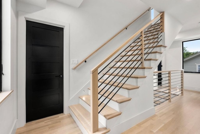 1242 Beacon St, Newton, MA 02468 - stairway with wood finished floors and baseboards