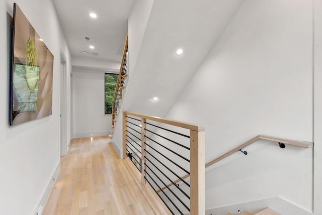 1242 Beacon St, Newton, MA 02468 - hallway with light wood-style floors, recessed lighting, an upstairs landing, and baseboards