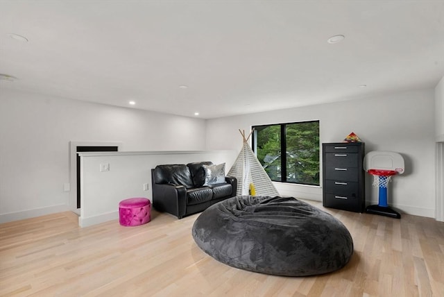 1242 Beacon St, Newton, MA 02468 - living area featuring light wood-style floors, recessed lighting, and baseboards