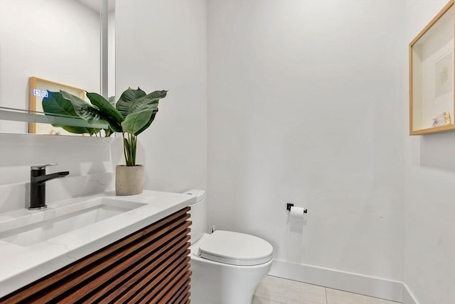 1242 Beacon St, Newton, MA 02468 - half bathroom featuring toilet, tile patterned flooring, vanity, and baseboards