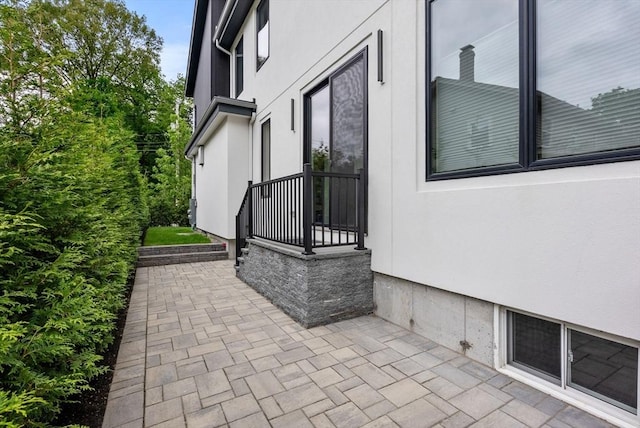 1242 Beacon St, Newton, MA 02468 - view of side of home featuring stucco siding