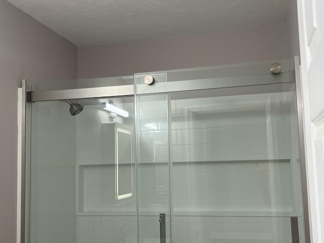 full bathroom featuring a shower stall