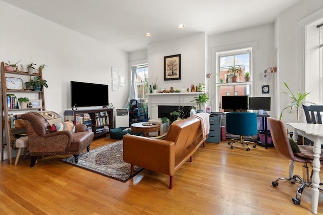 1750 Washington St Unit 2, Boston, MA 02118 - living area with wood finished floors, recessed lighting, and a fireplace