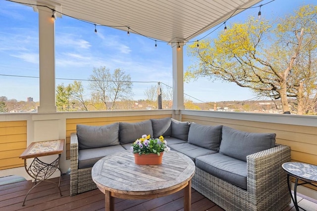 wooden deck featuring outdoor lounge area