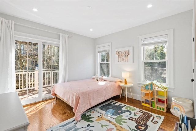 bedroom featuring access to outside, recessed lighting, and wood finished floors
