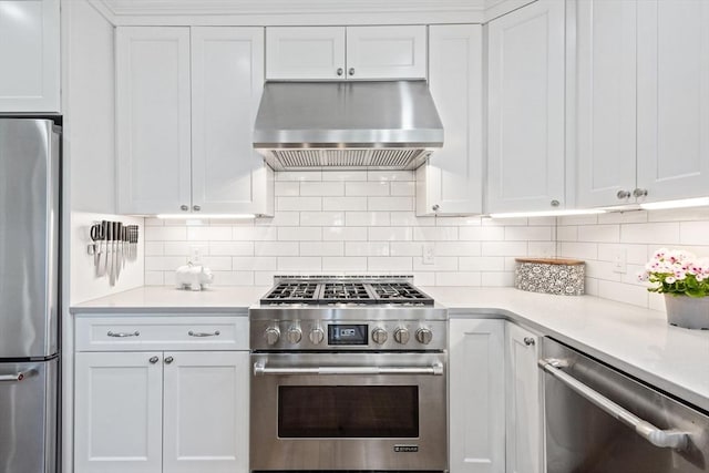 kitchen with light countertops, stainless steel appliances, white cabinetry, and under cabinet range hood