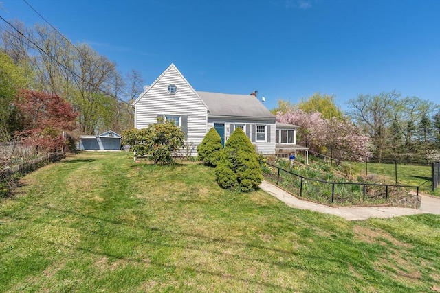 exterior space with fence and a yard