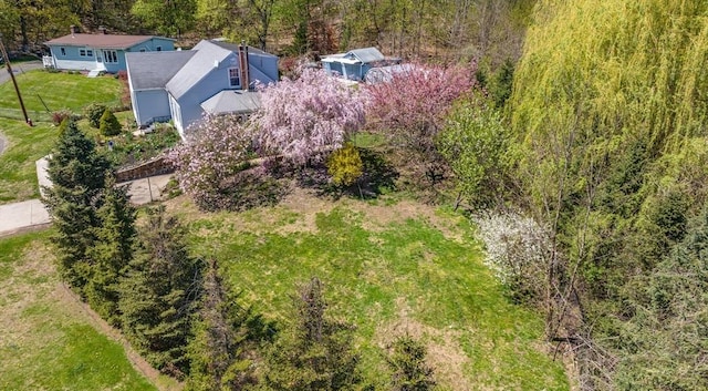 birds eye view of property with a wooded view