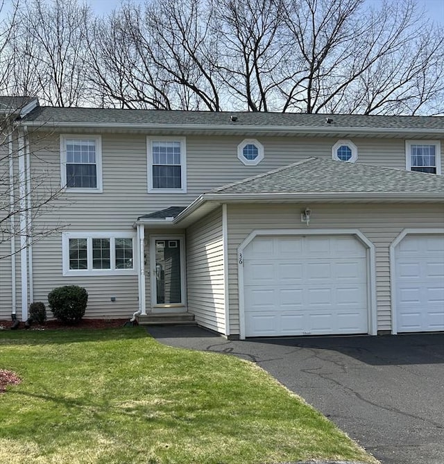 585 Sheridan St Unit 36, Chicopee, MA 01020 - view of front of property with driveway, an attached garage, entry steps, a front yard, and roof with shingles