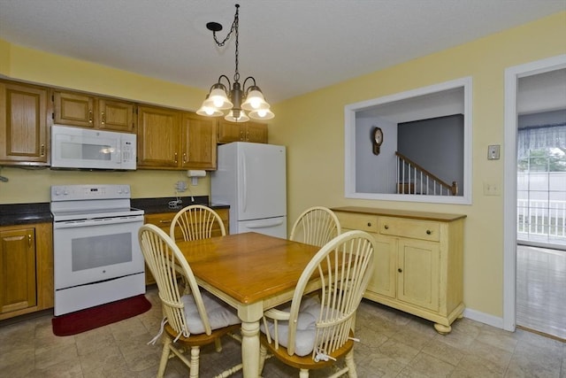 585 Sheridan St Unit 36, Chicopee, MA 01020 - interior space featuring baseboards and a notable chandelier
