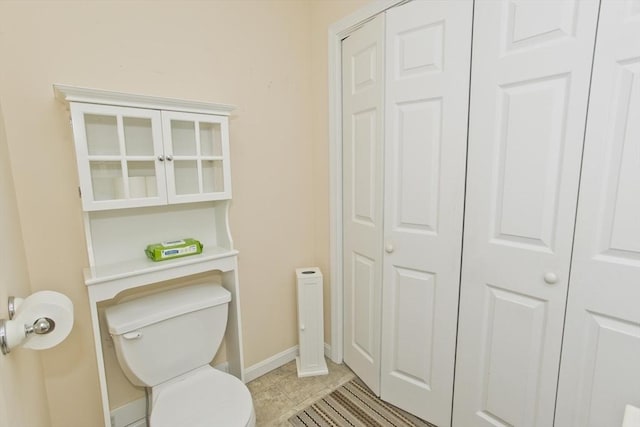 585 Sheridan St Unit 36, Chicopee, MA 01020 - bathroom with a closet, toilet, baseboards, and tile patterned floors