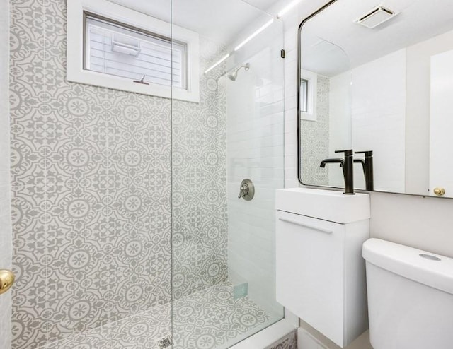 52-54 Bonair St, Somerville, MA 02145 - bathroom featuring a tile shower and toilet