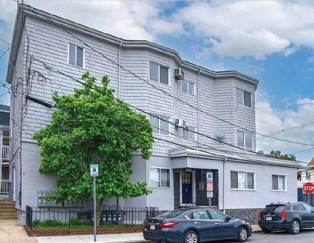 52-54 Bonair St, Somerville, MA 02145 - view of front of home with stucco siding