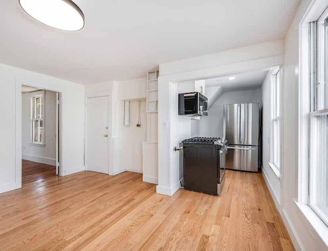 52-54 Bonair St, Somerville, MA 02145 - kitchen featuring stainless steel appliances and light wood finished floors