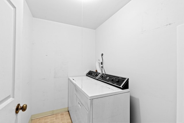 washroom with washer and dryer