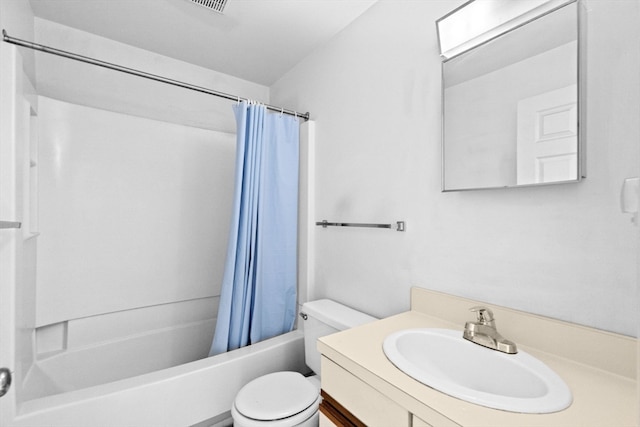 full bathroom featuring shower / bath combo with shower curtain, vanity, and toilet