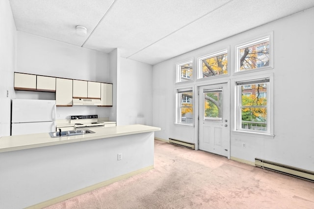 kitchen with white cabinetry, white appliances, a textured ceiling, and light colored carpet