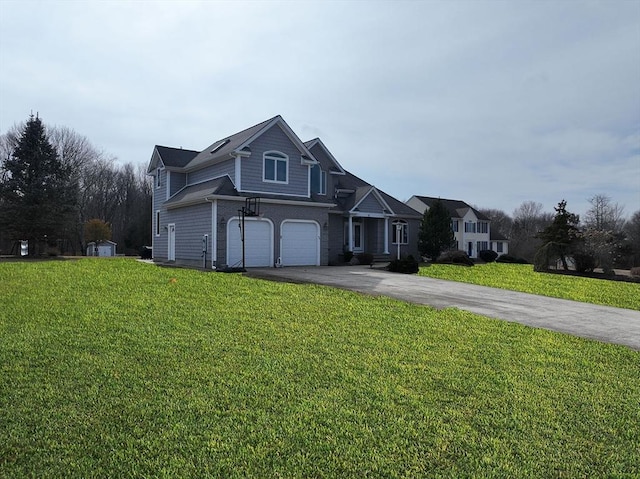 traditional-style home with aphalt driveway, a front yard, and an attached garage