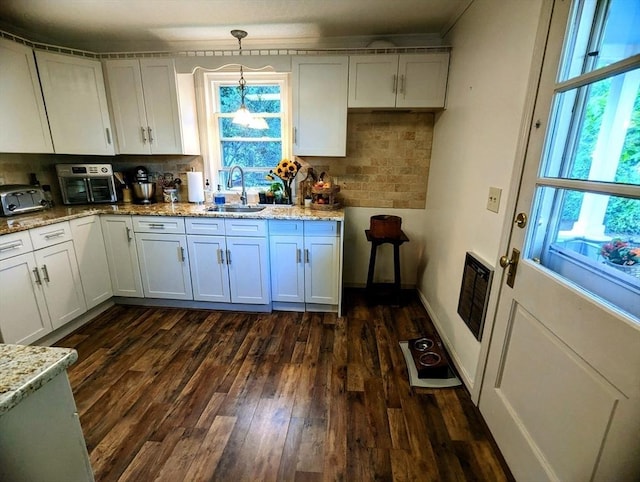 40 Ayer Rd, Shirley, MA 01464 - kitchen with decorative backsplash, dark wood finished floors, light stone counters, and plenty of natural light