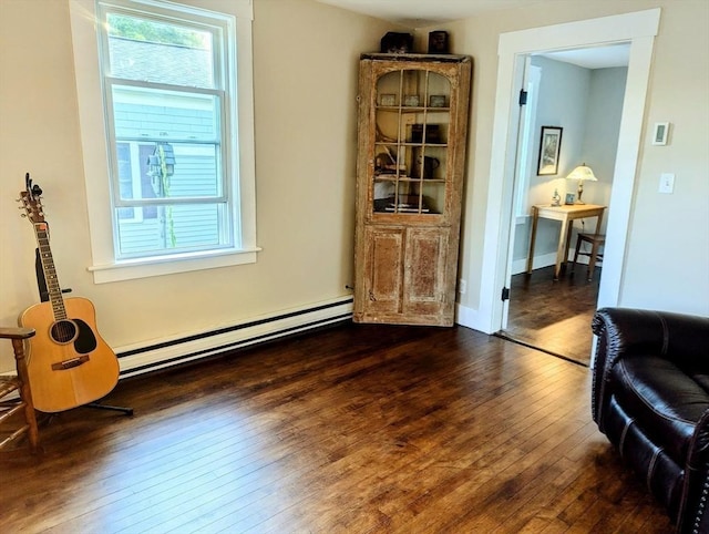 40 Ayer Rd, Shirley, MA 01464 - living area featuring a baseboard heating unit and hardwood / wood-style floors