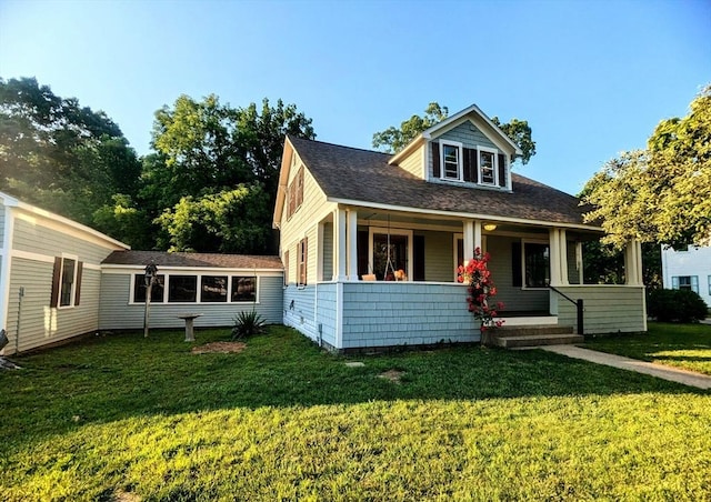 40 Ayer Rd, Shirley, MA 01464 - bungalow-style home featuring a front yard, covered porch, and a shingled roof