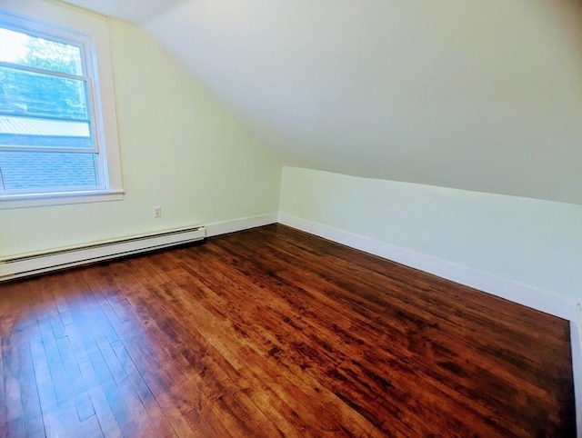 40 Ayer Rd, Shirley, MA 01464 - bonus room with a baseboard heating unit, vaulted ceiling, and dark wood-style flooring