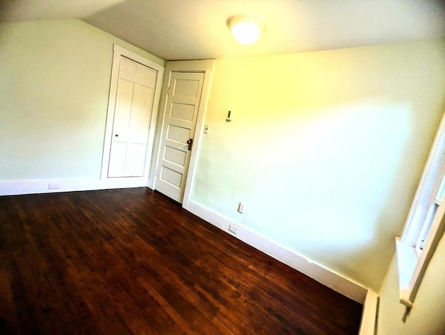 40 Ayer Rd, Shirley, MA 01464 - unfurnished bedroom with dark wood finished floors and vaulted ceiling