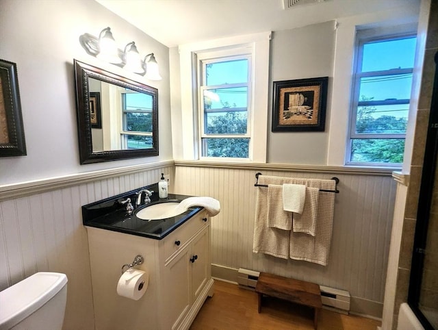 40 Ayer Rd, Shirley, MA 01464 - bathroom with a wainscoted wall, vanity, wood finished floors, and a baseboard radiator