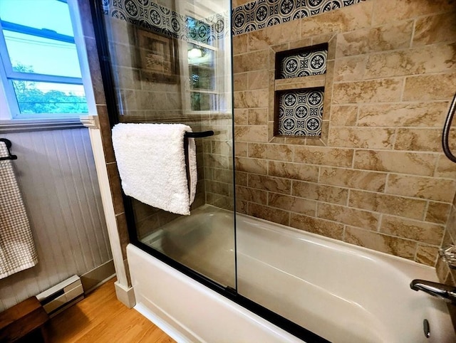 40 Ayer Rd, Shirley, MA 01464 - bathroom featuring a baseboard radiator, wood finished floors, and enclosed tub / shower combo