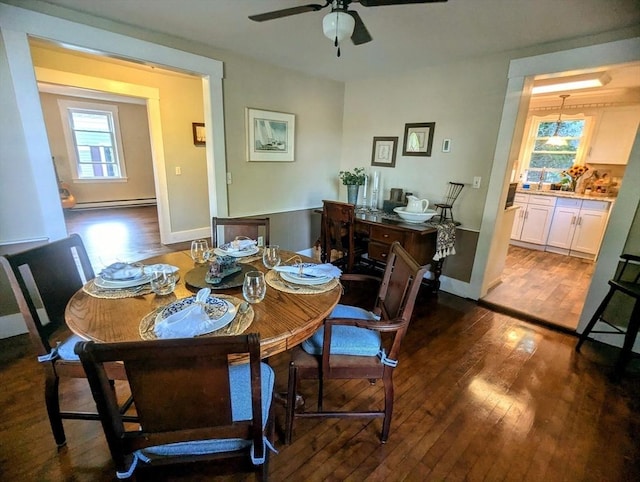 40 Ayer Rd, Shirley, MA 01464 - dining room featuring dark wood-style floors, a ceiling fan, and a baseboard radiator