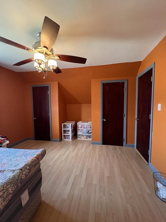 1 Coburn Ct, Lowell, MA 01854 - bedroom with light wood-style floors and ceiling fan