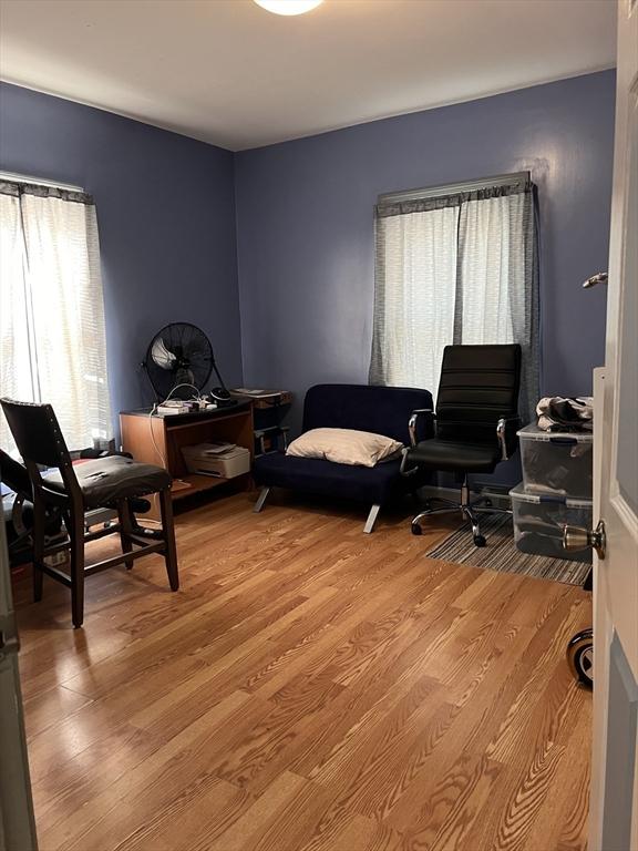 1 Coburn Ct, Lowell, MA 01854 - living area featuring light wood finished floors