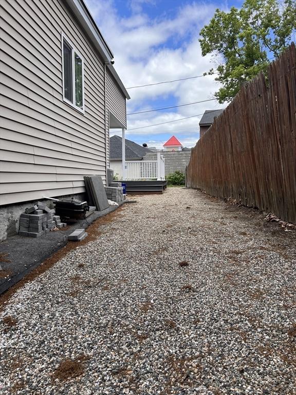 1 Coburn Ct, Lowell, MA 01854 - view of yard with a deck