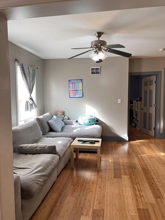 1 Coburn Ct, Lowell, MA 01854 - living area featuring ceiling fan and light wood-style floors