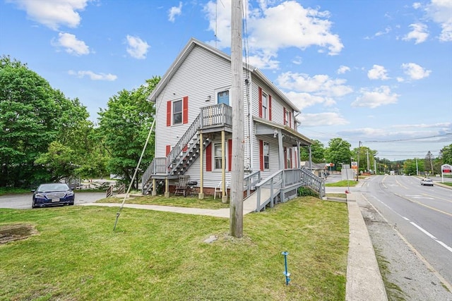 32 Worcester Rd, Charlton, MA 01507 - view of side of home featuring stairs and a yard