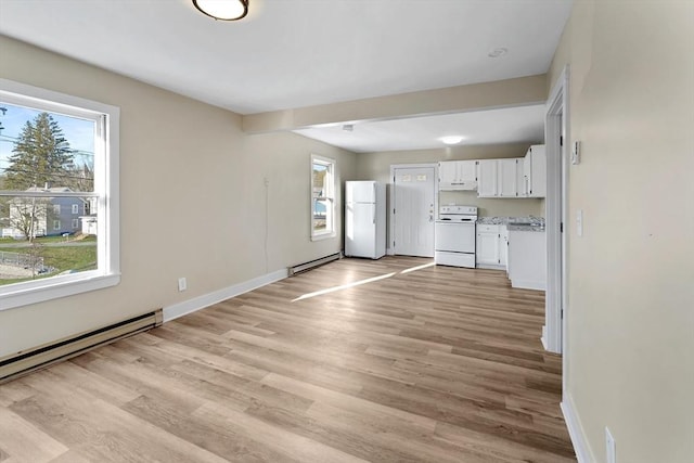 32 Worcester Rd, Charlton, MA 01507 - unfurnished living room with a baseboard heating unit, plenty of natural light, light wood finished floors, and baseboards