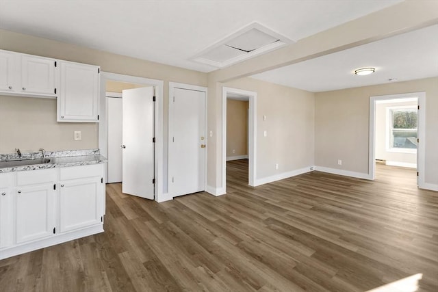 32 Worcester Rd, Charlton, MA 01507 - kitchen with a sink, white cabinetry, and dark wood-style flooring