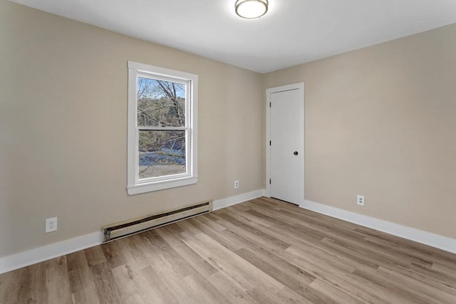 32 Worcester Rd, Charlton, MA 01507 - unfurnished room featuring a baseboard heating unit, light wood finished floors, and baseboards