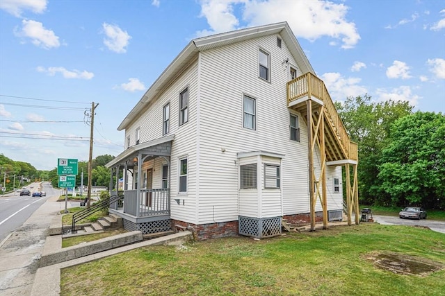32 Worcester Rd, Charlton, MA 01507 - view of home's exterior with a yard and a balcony